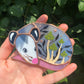 Sleepy Green Mushroom Opossum Stained Glass Ornament