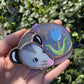 Sleepy Blue Iridescent Tulip Opossum Stained Glass Ornament