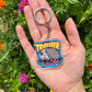 Trasher Opossum Acrylic Keychain
