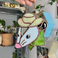 Cracked! Green Mini Cowboy Opossum Stained Glass Ornament